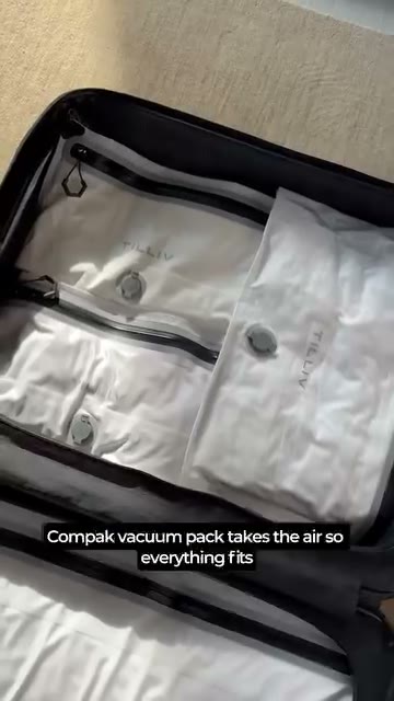 Tilliv ad frame showing several Compak vacuum packs inside a suitcase